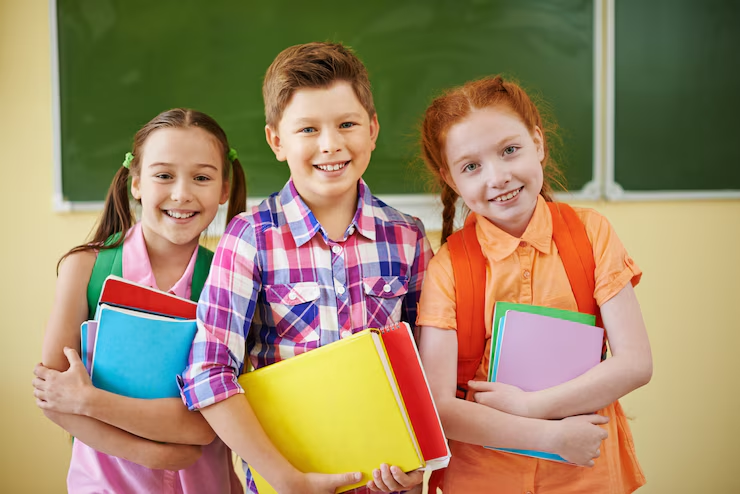Group of children smiling in classroom
